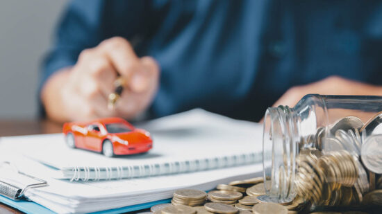 Concept of car insurance business, saving buy - sale with tax and loan for new car. Car toy vehicle with stack coin money on background. Planning to manage transportation finance costs. loan for car