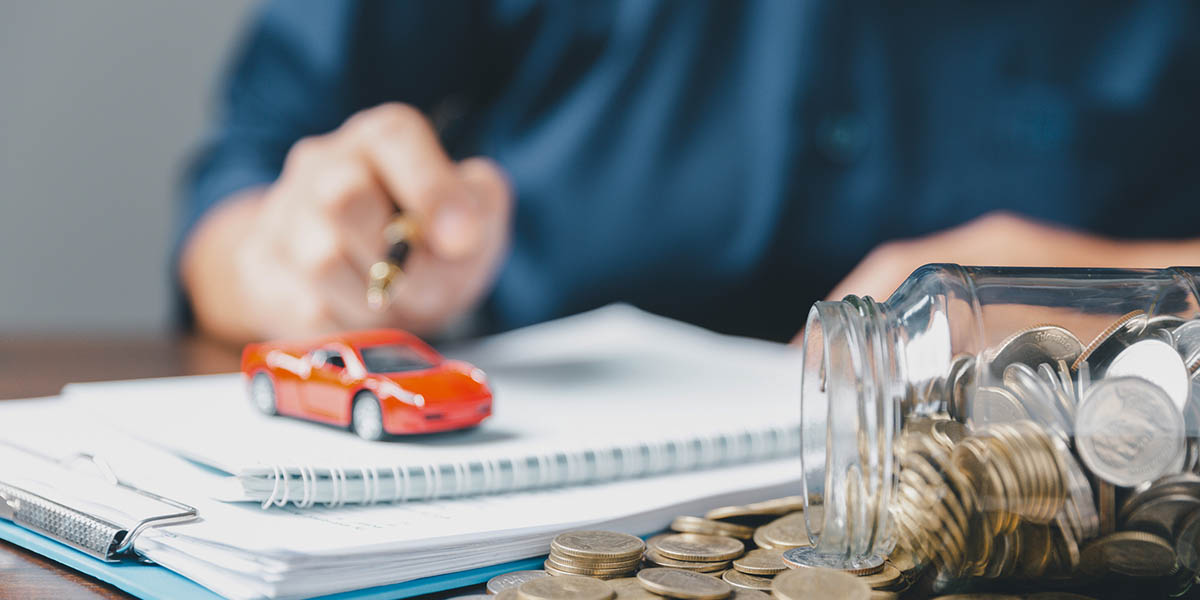 Concept of car insurance business, saving buy - sale with tax and loan for new car. Car toy vehicle with stack coin money on background. Planning to manage transportation finance costs. loan for car