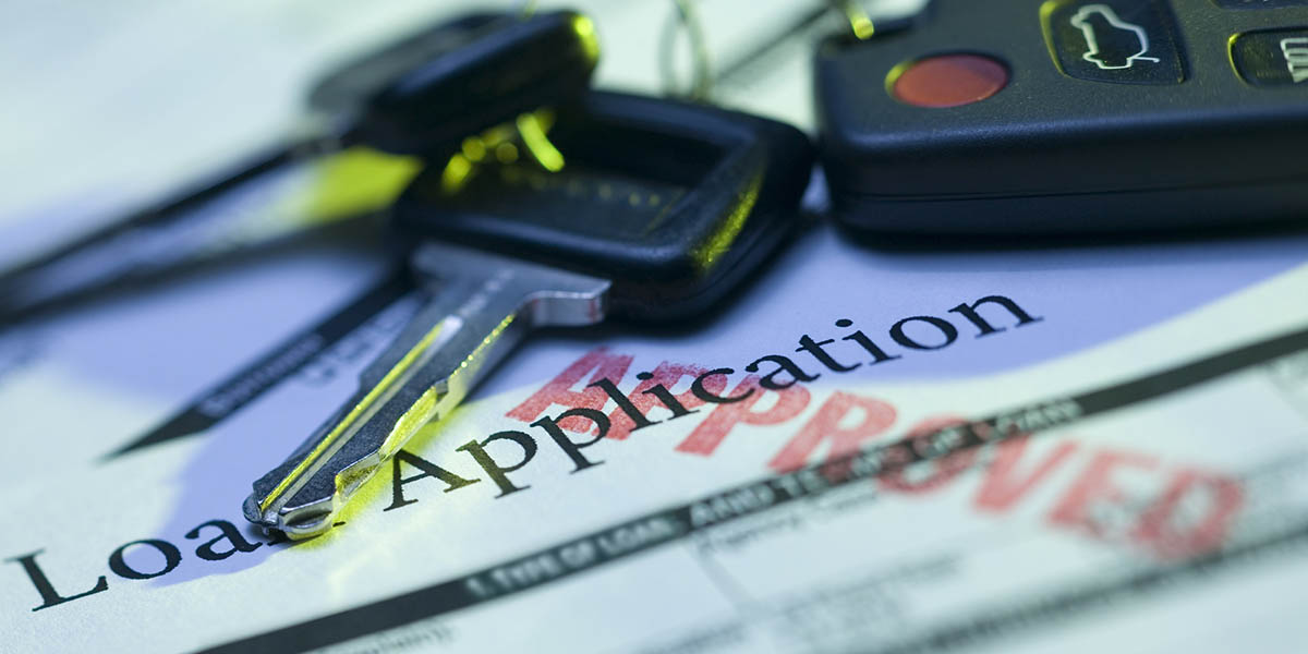 Car keys and approved loan application