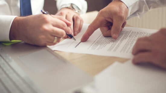 Business man signing a contract