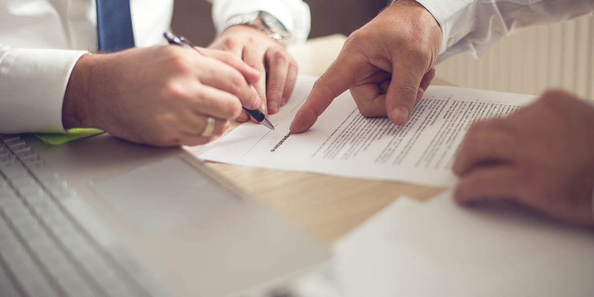 Business man signing a contract
