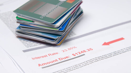 Stack of credit cards on account of value in red