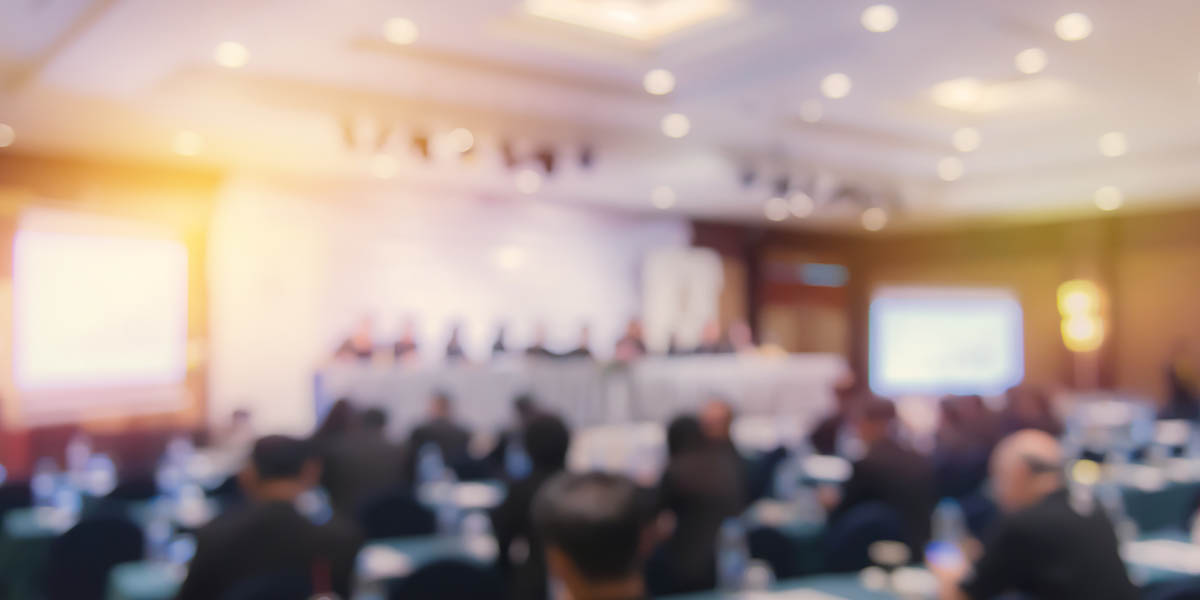Defocused Image Of Business People At Seminar