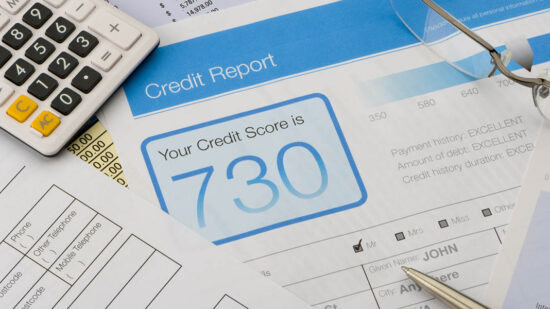 Credit report form on a desk with other paperwork.