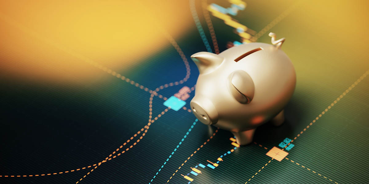 Gold Colored Piggy Bank Sitting over A Bar Graph - Savings Concept