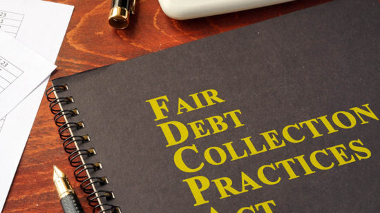 FDCPA Fair Debt Collection Practices Act on a table.