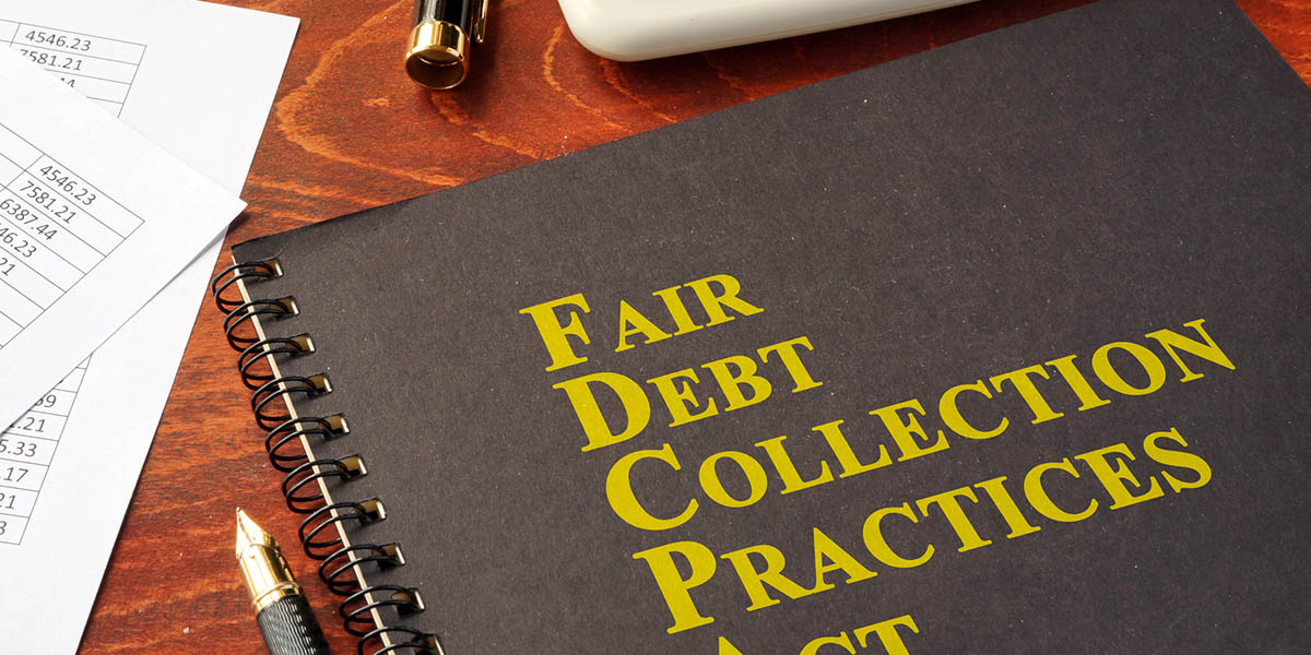 FDCPA Fair Debt Collection Practices Act on a table.