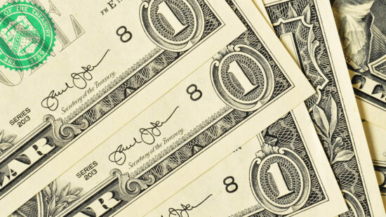 US Dollars paper currency closed up background