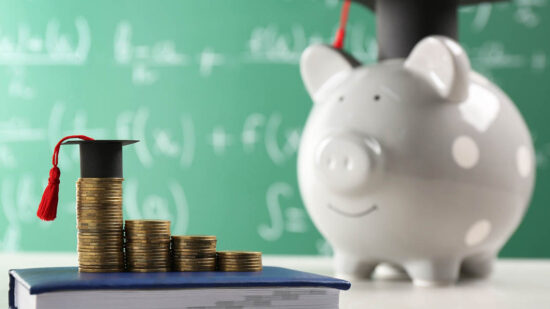 Scholarship concept. Coins, graduation cap and book on light grey table, space for text